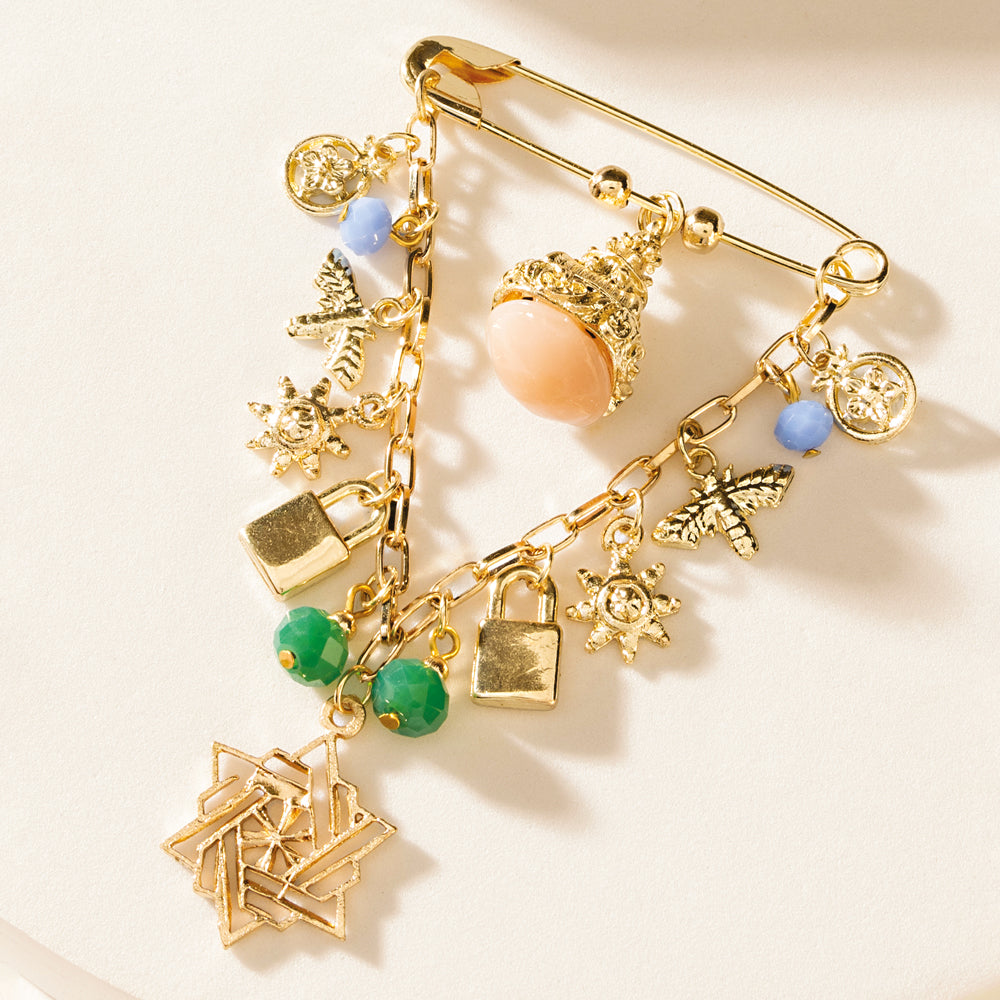 Sheriff’s Trail Charm Brooch in Starfire Gold