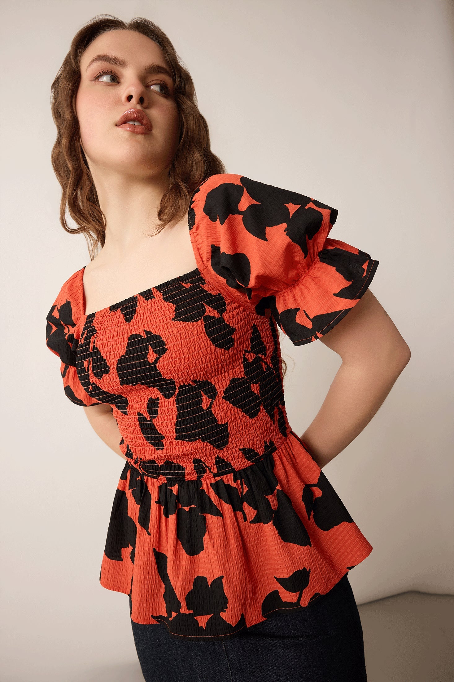 Bailey in Bold Peplum Top In Orange and Black - Myra USA