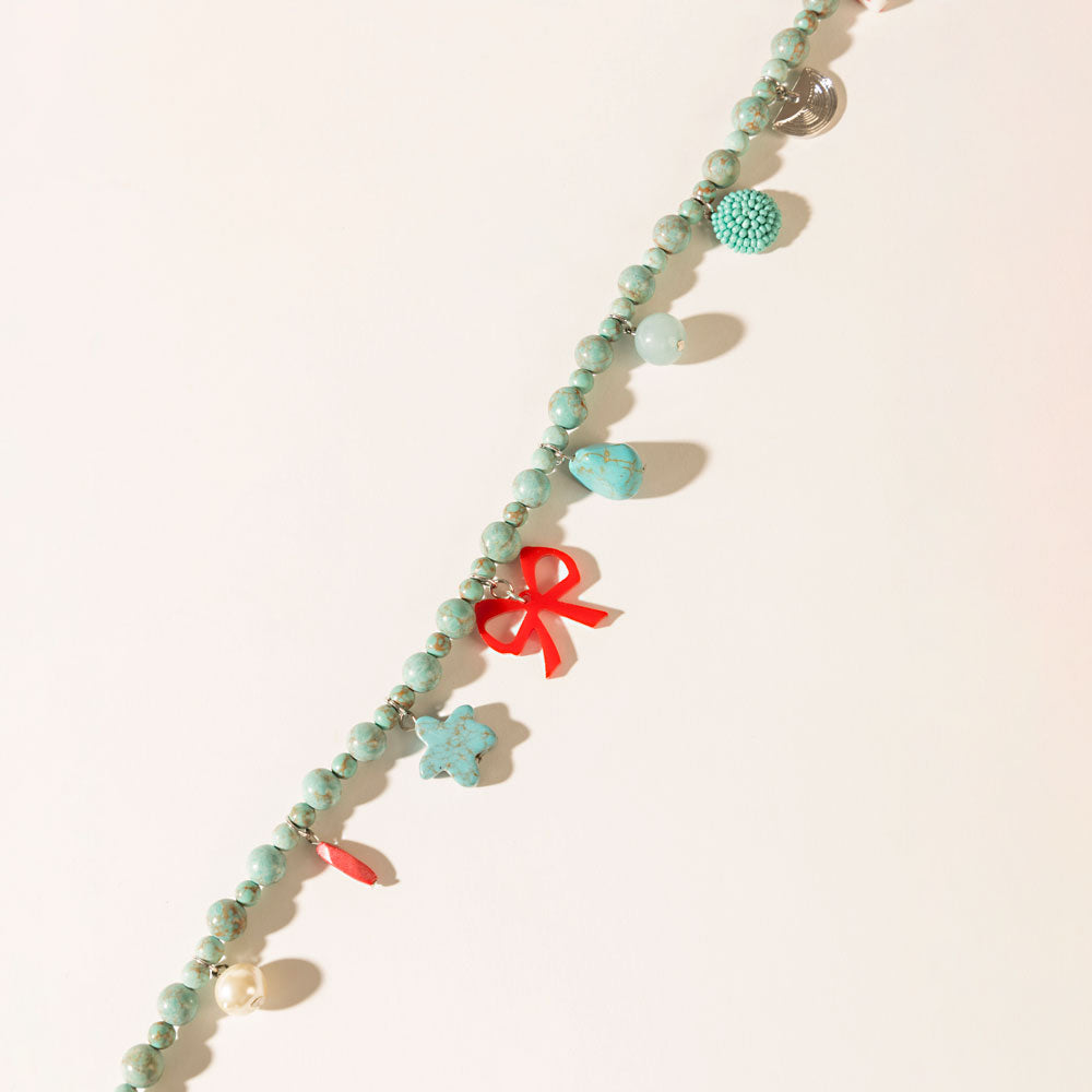 Nina’s Lucky Bag Charm in Ocean Blue