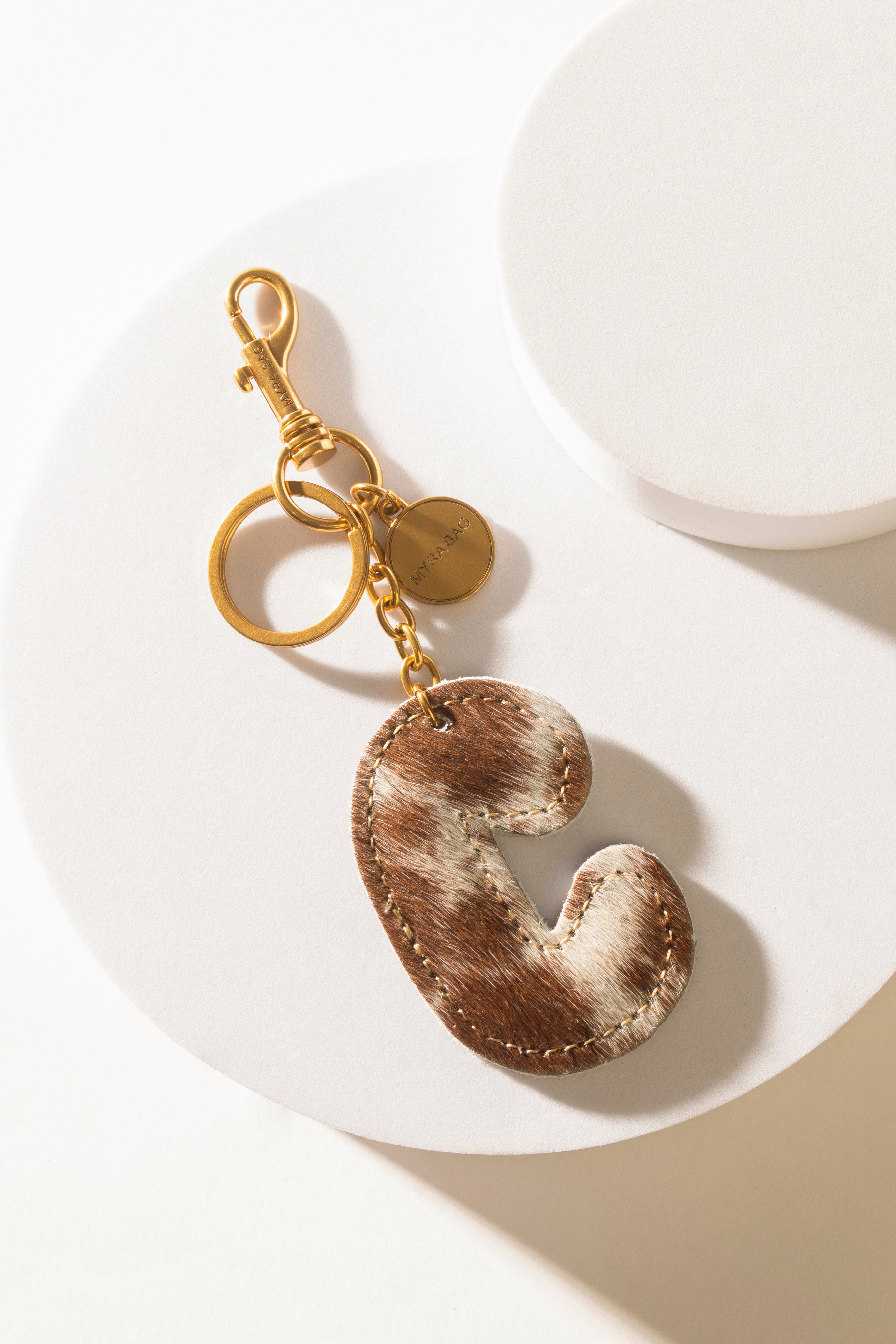 Alpha Hairon Bag Charm in Brown & White - Myra USA