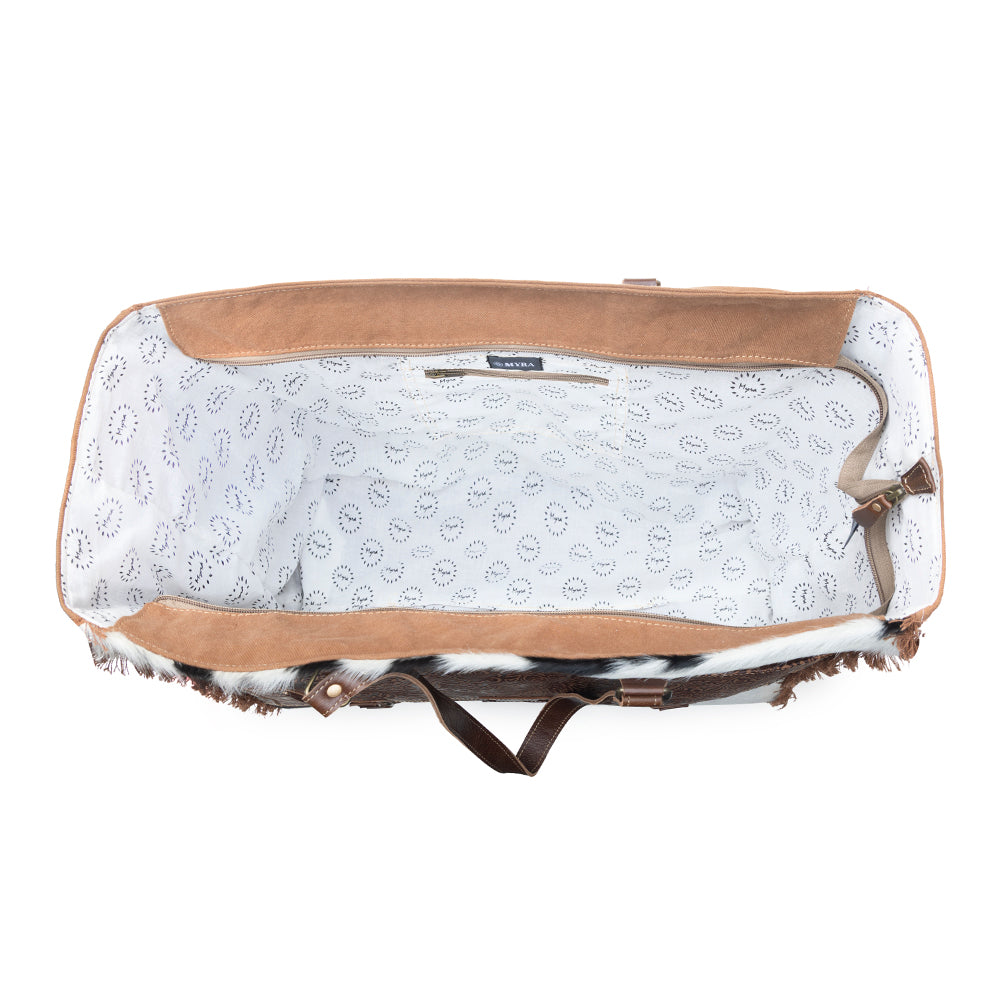 Myra Forester Junction Weekender Bag in tan with hair on and embossed leather