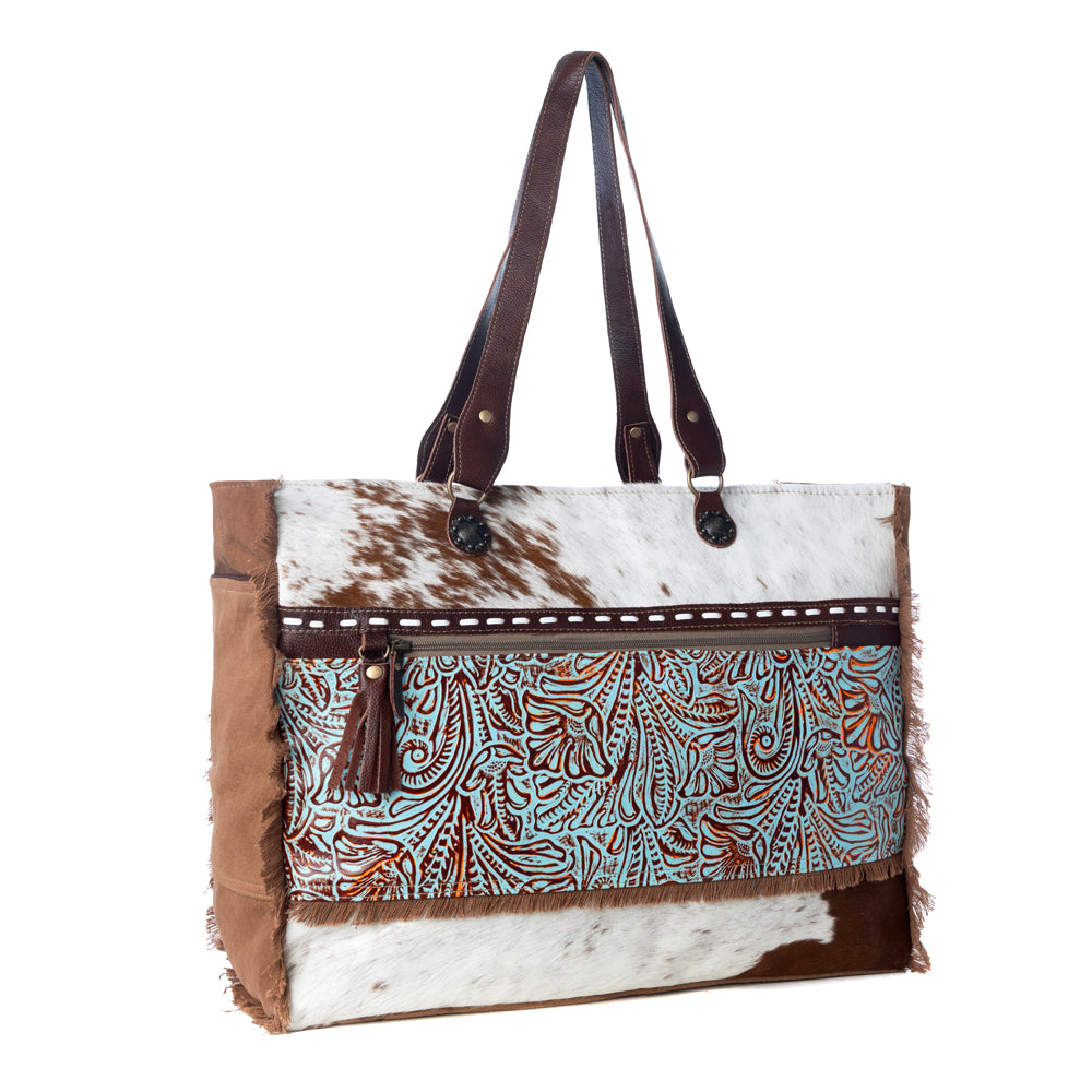 Myra Juniper Weekender Bag for Women with upcycled canvas and hairon hide with embossed leather detail