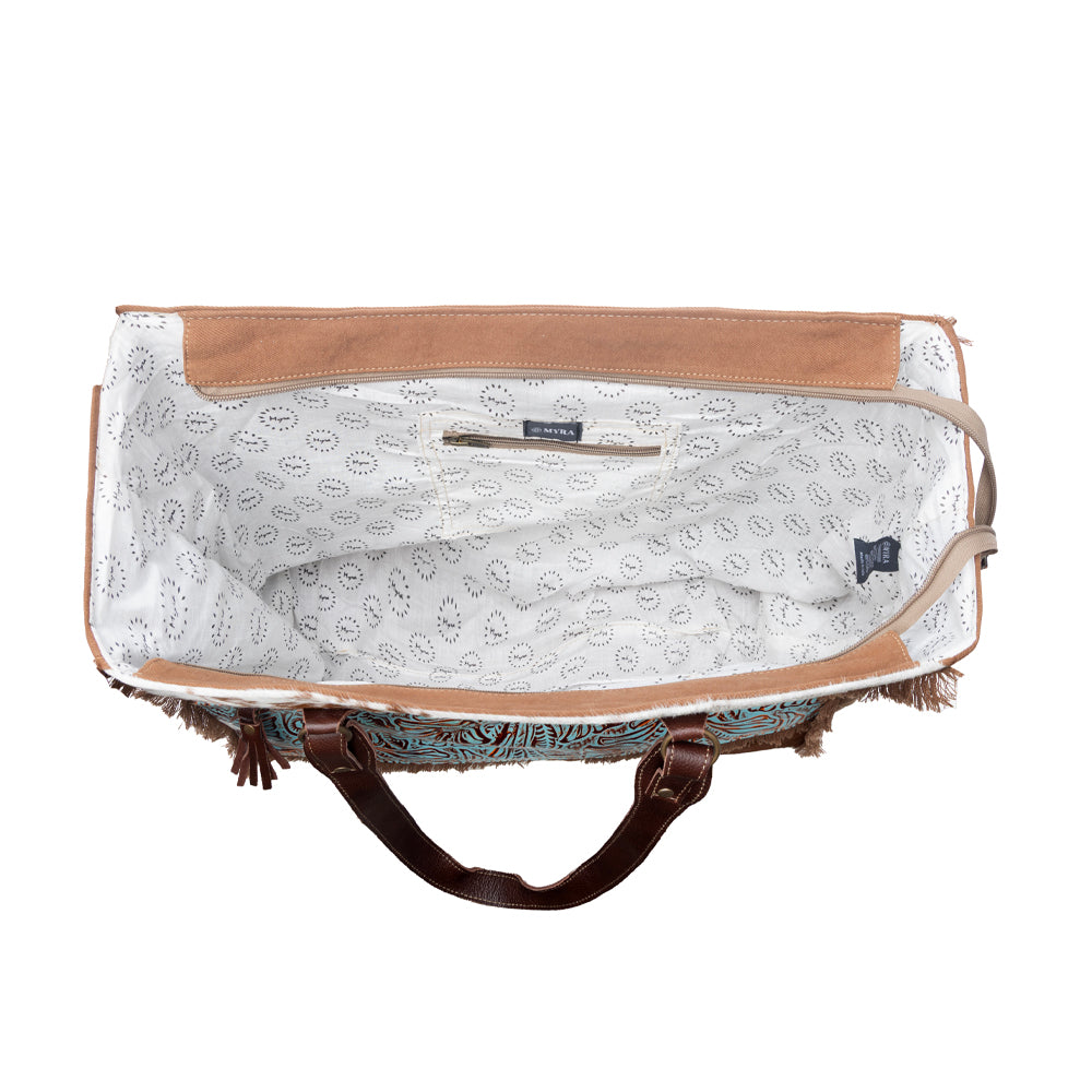 Myra Juniper Weekender Bag for Women with upcycled canvas and hairon hide with embossed leather detail - Myra USA