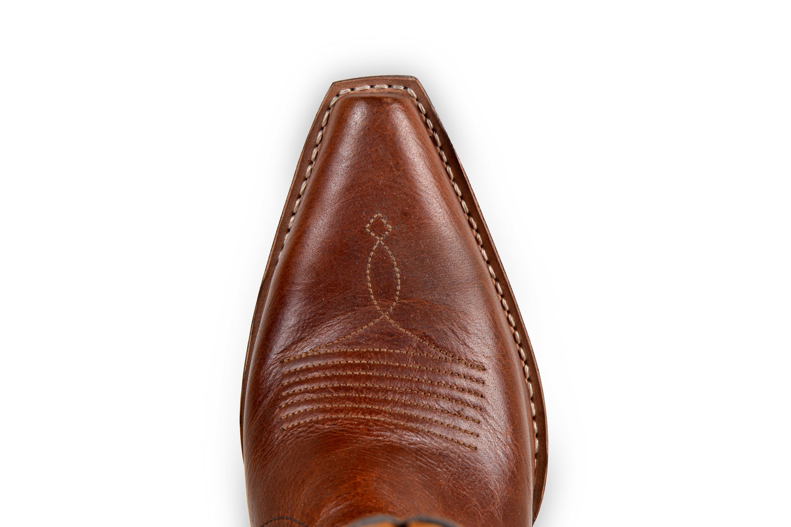 Brown leather embroided cowgirl boots with a pointed toe and a stacked heel