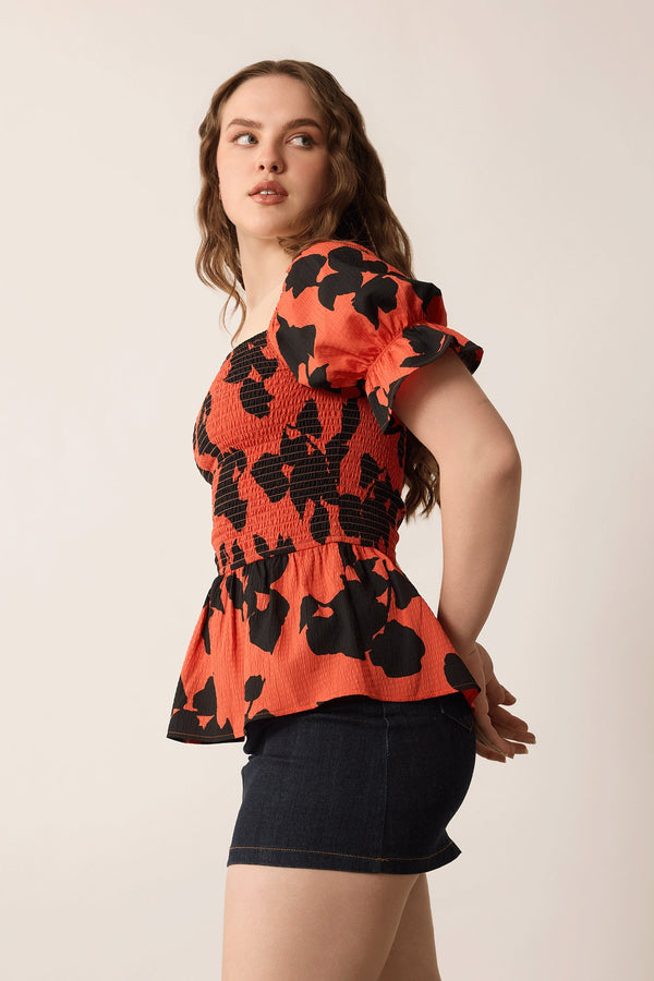 Bailey in Bold Peplum Top In Orange and Black - Myra USA