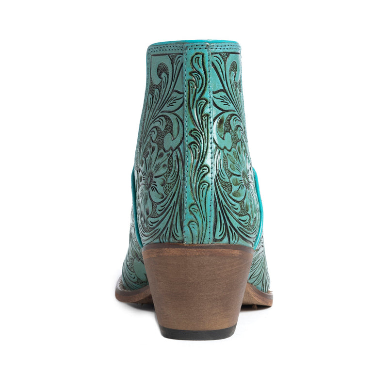 Mayra's hand-tooled western booties in turquoise color with a medium-height heel.