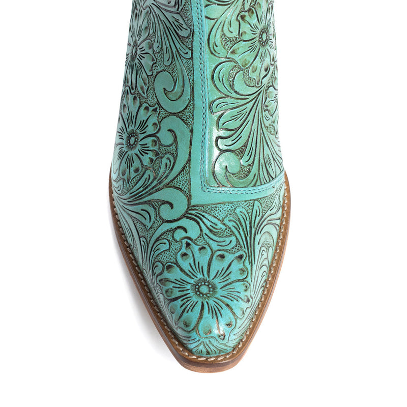 Mayra's hand-tooled western booties in turquoise color with a medium-height heel.