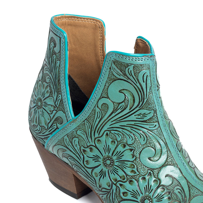 Mayra's hand-tooled western booties in turquoise color with a medium-height heel.