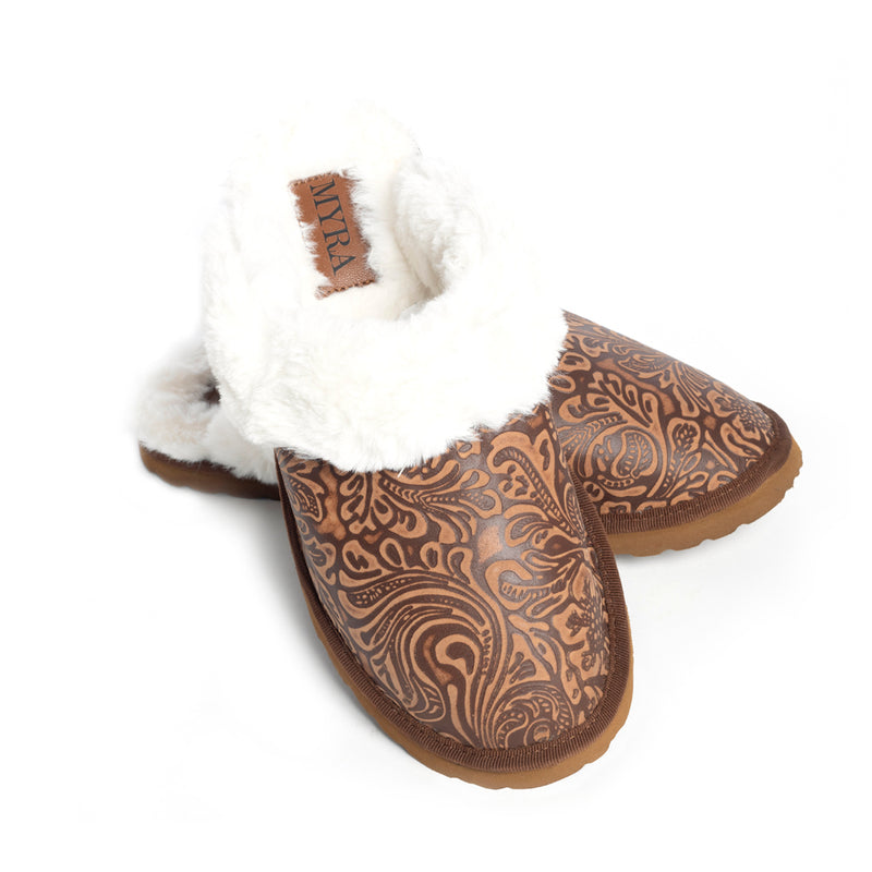 Western slippers with a brown patterned exterior and white fluffy lining