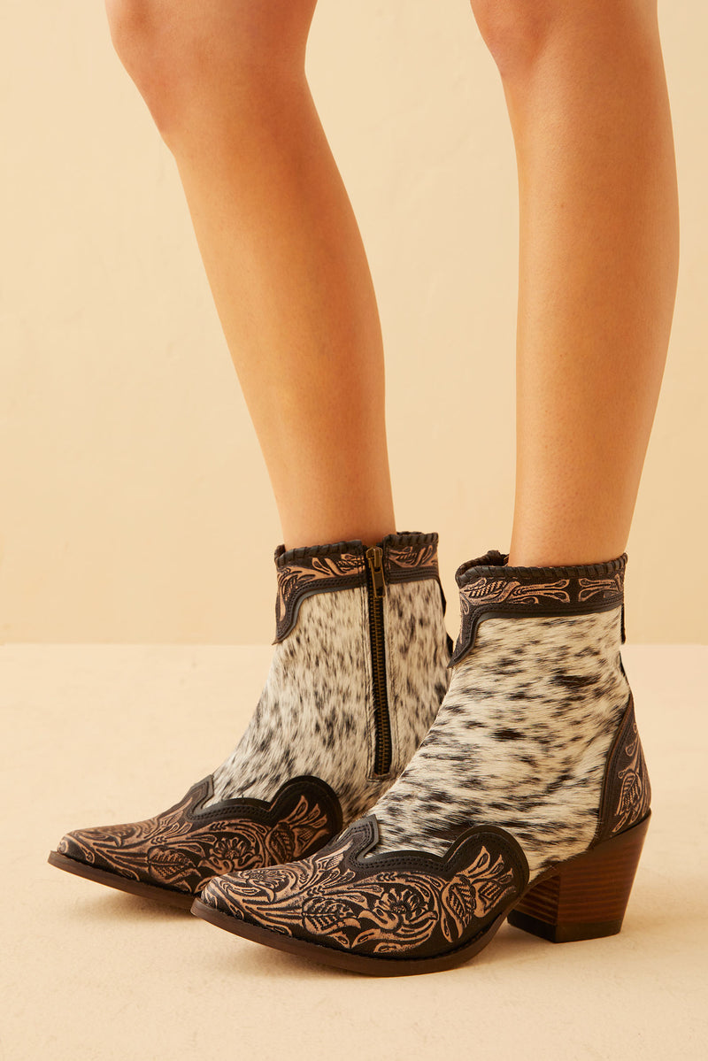 Women's Western Booties in white, black, and brown colors of cowhide patterns 