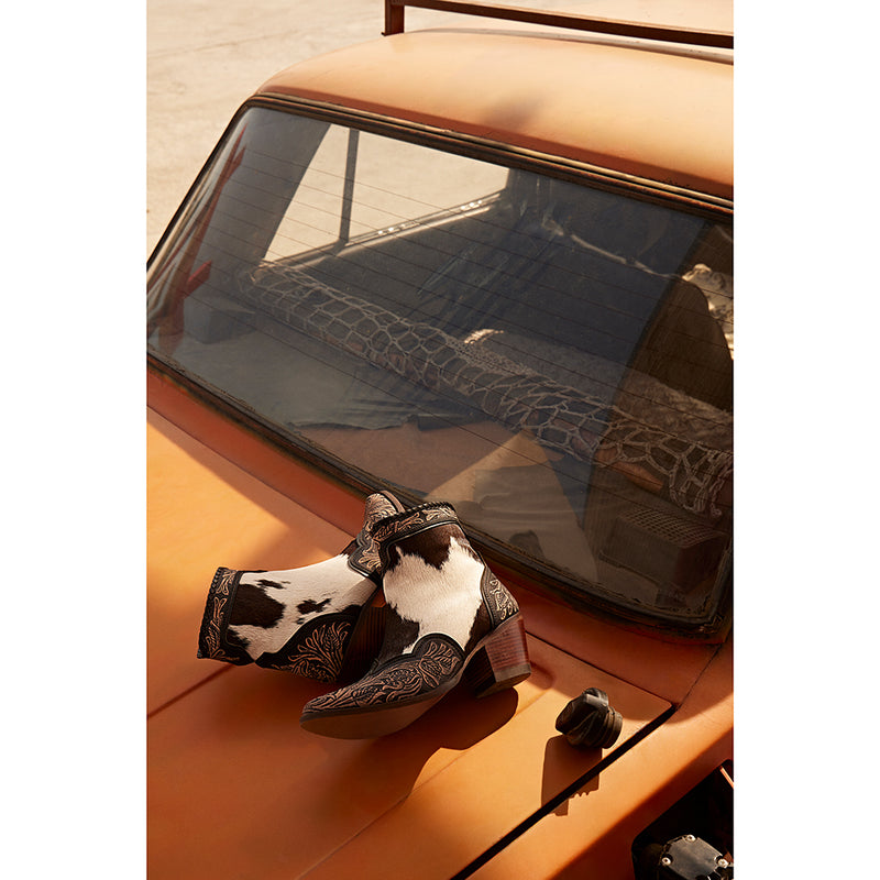 Women's Western Booties in white, black, and brown colors of cowhide patterns 