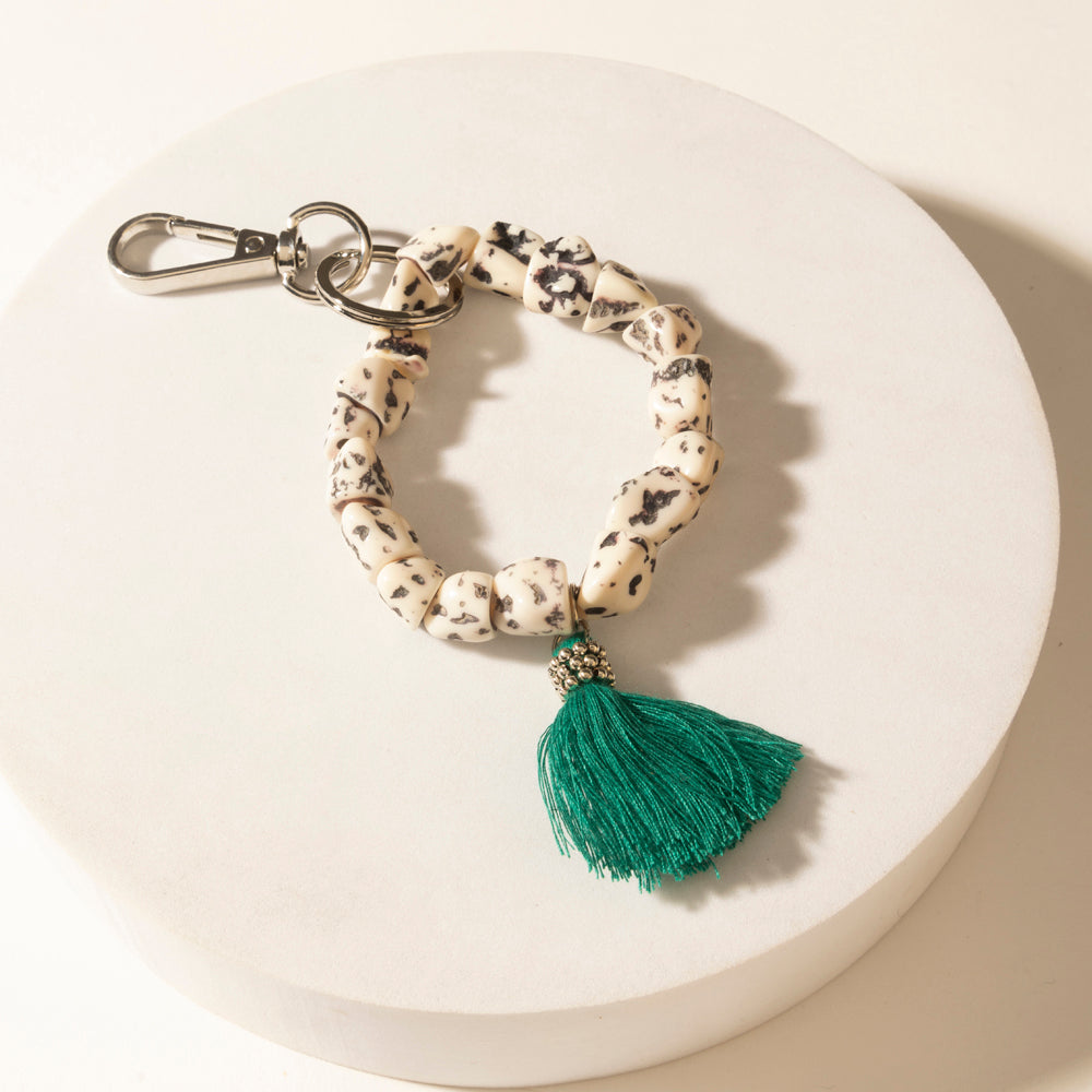 Myra Canyon Storm Tassel Keychain in Speckled Dust - Myra USA