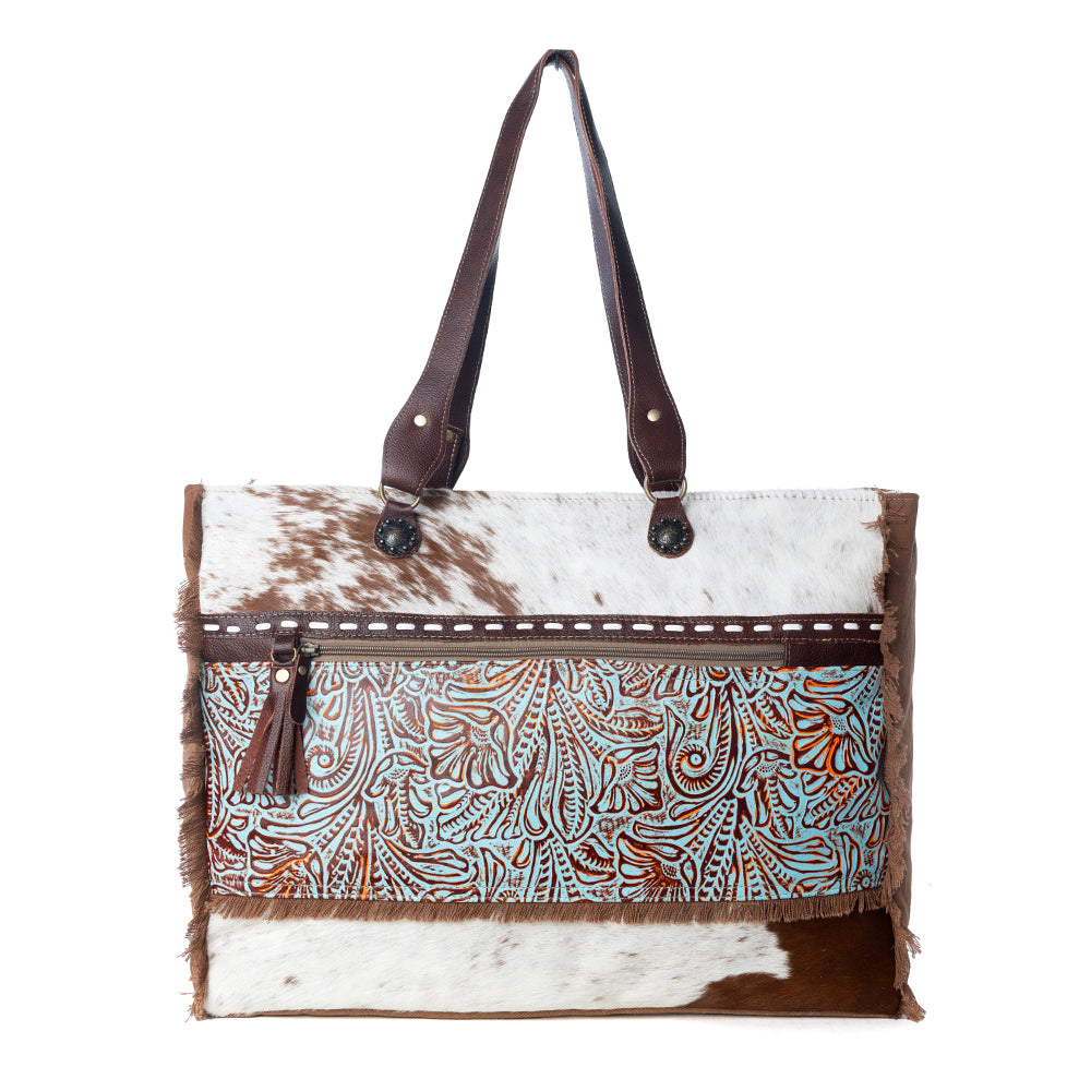 Myra Juniper Weekender Bag for Women with upcycled canvas and hairon hide with embossed leather detail
