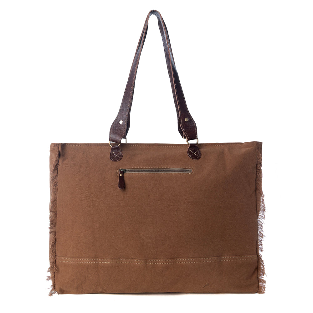 Myra Juniper Weekender Bag for Women with upcycled canvas and hairon hide with embossed leather detail - Myra USA