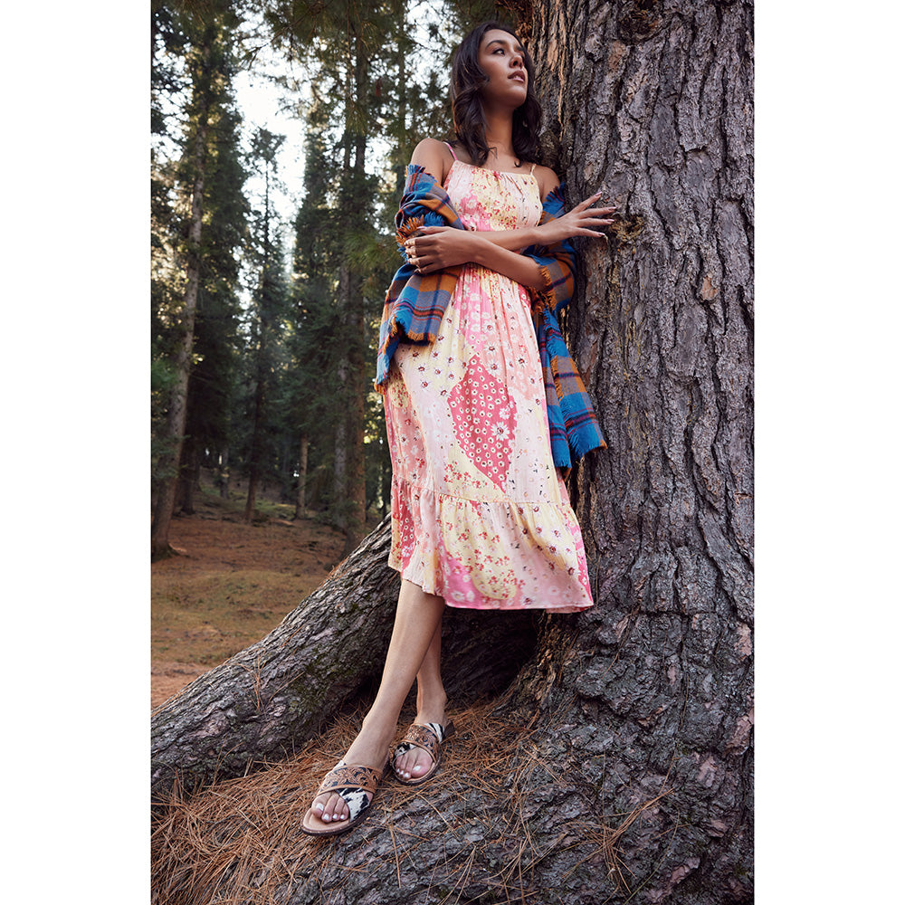 Chappy tooled leather sandals with with an open-toe design in shades of brown, black and white