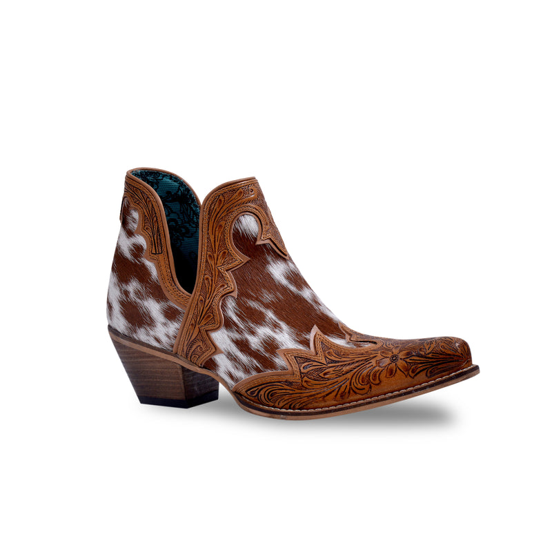 Brown and white cowgirl boots with a pointed toe, small heel and detailed stitching