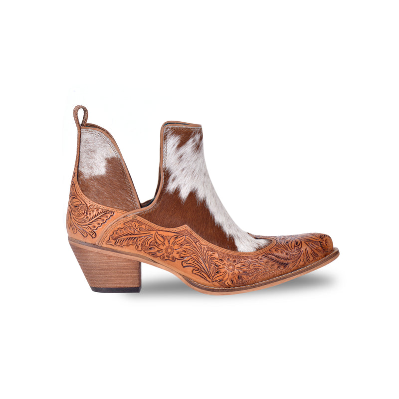 Brown and white cowgirl booties with tooled leather in floral pattern