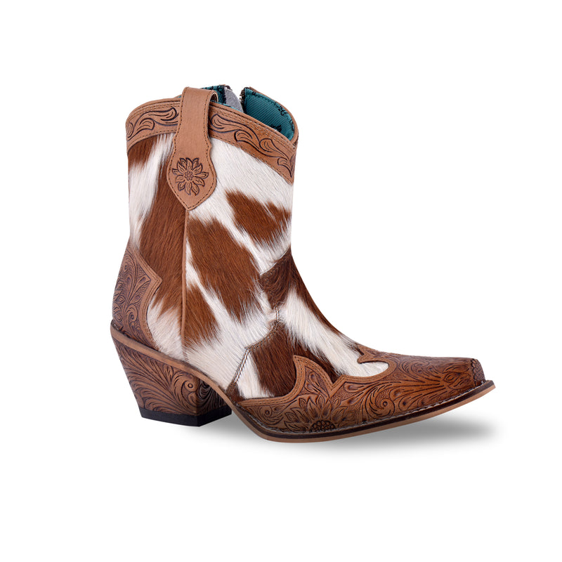 White and brown cowgirl boots with embossed floral patterns on the toe and heel areas