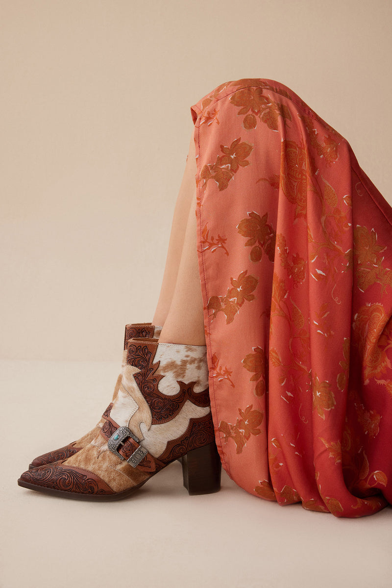 Western booties with white and brown cowhide