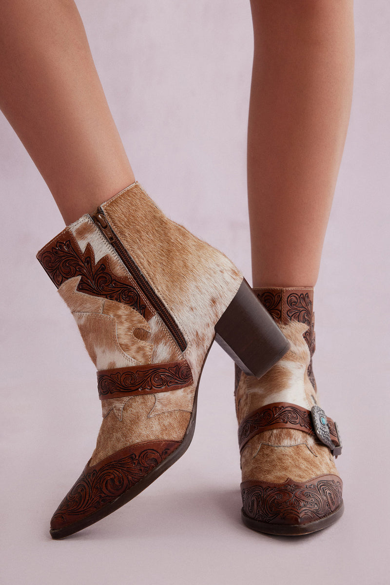 Western booties with white and brown cowhide