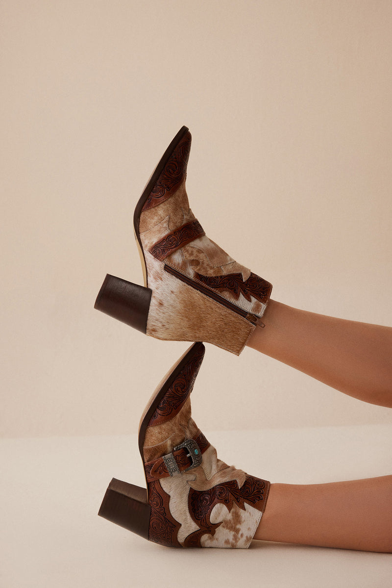 Western booties with white and brown cowhide