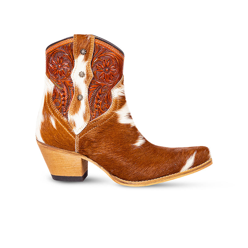 Brown and white cowhide & hand tooled western boots with slightly elevated heels and pointed toes