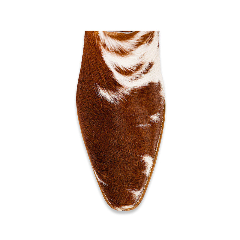 Brown and white cowhide & hand tooled western boots with slightly elevated heels and pointed toes