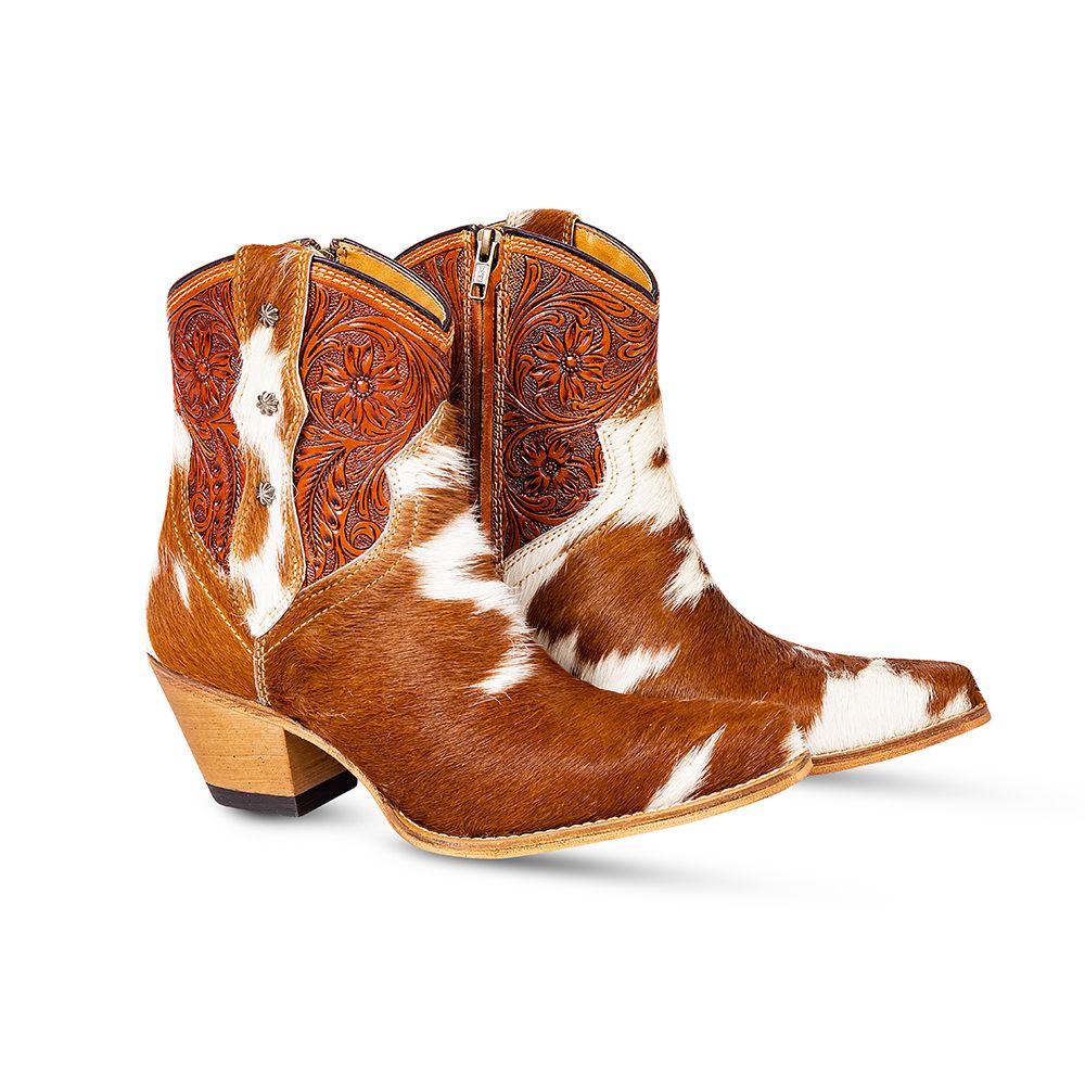 Brown and white cowhide & hand tooled western boots with slightly elevated heels and pointed toes