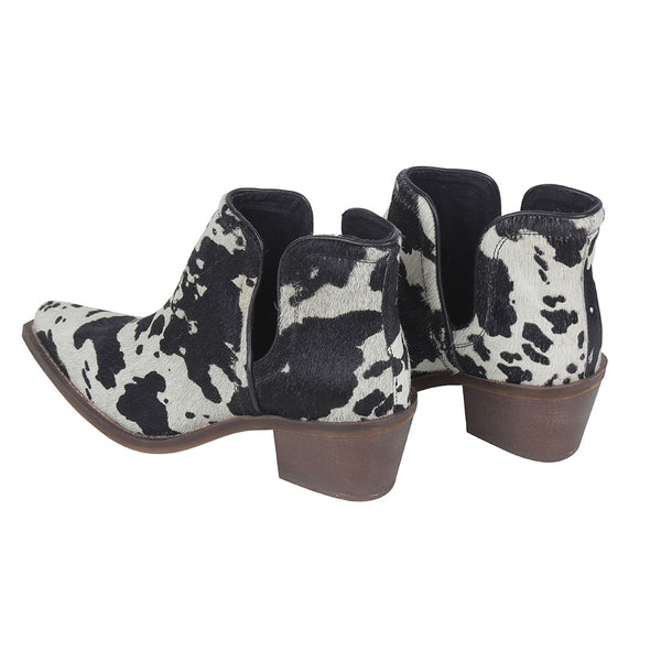 Women's Classic Western Booties in black and white cowhide with pointed toe and low block heels