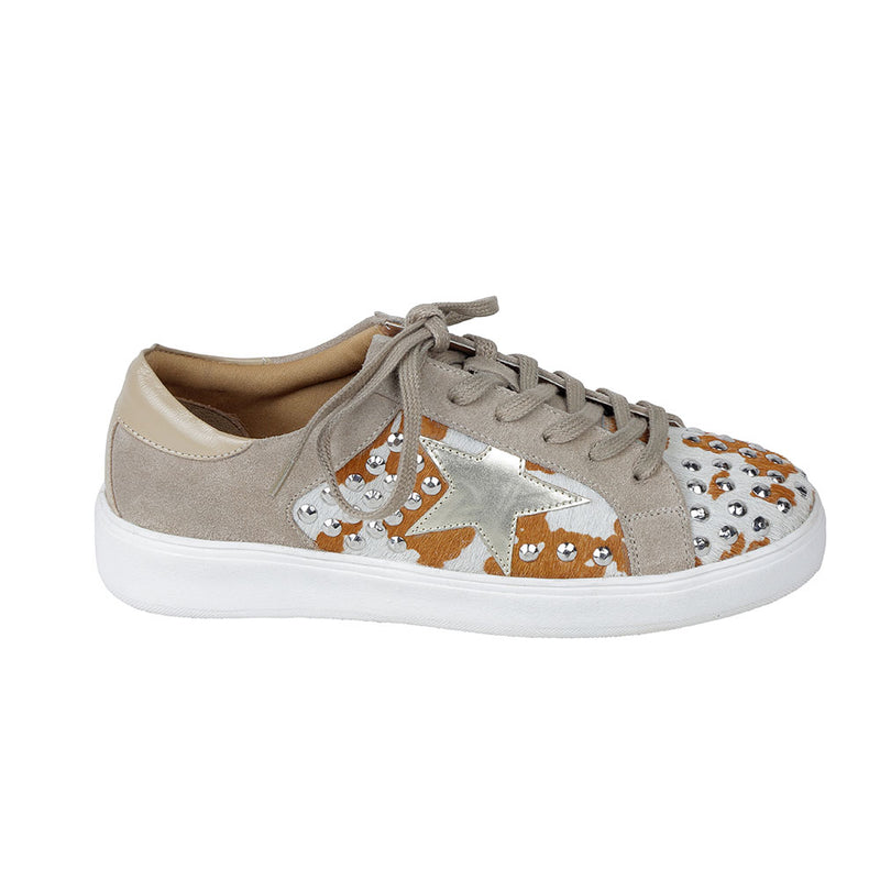 White low-top and lace-up western sneakers with small shiny studs and brown patches