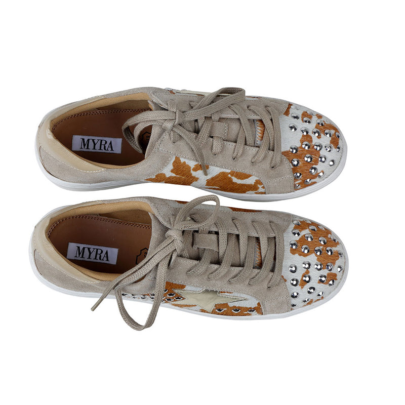 White low-top and lace-up western sneakers with small shiny studs and brown patches