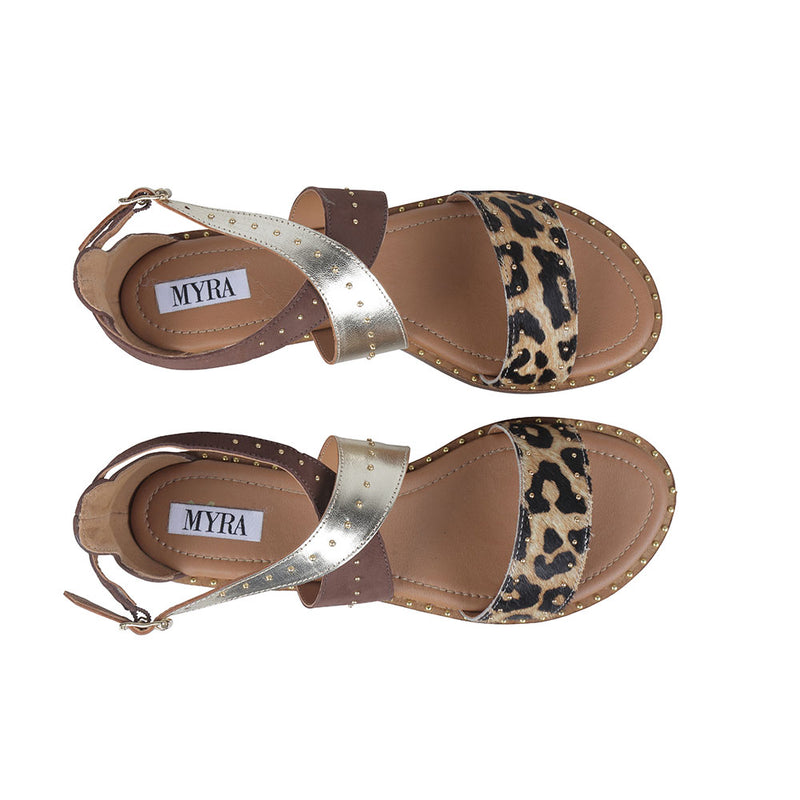 Western sandals with open-toe design in a combination of solid brown, tiger print, and metallic strap details