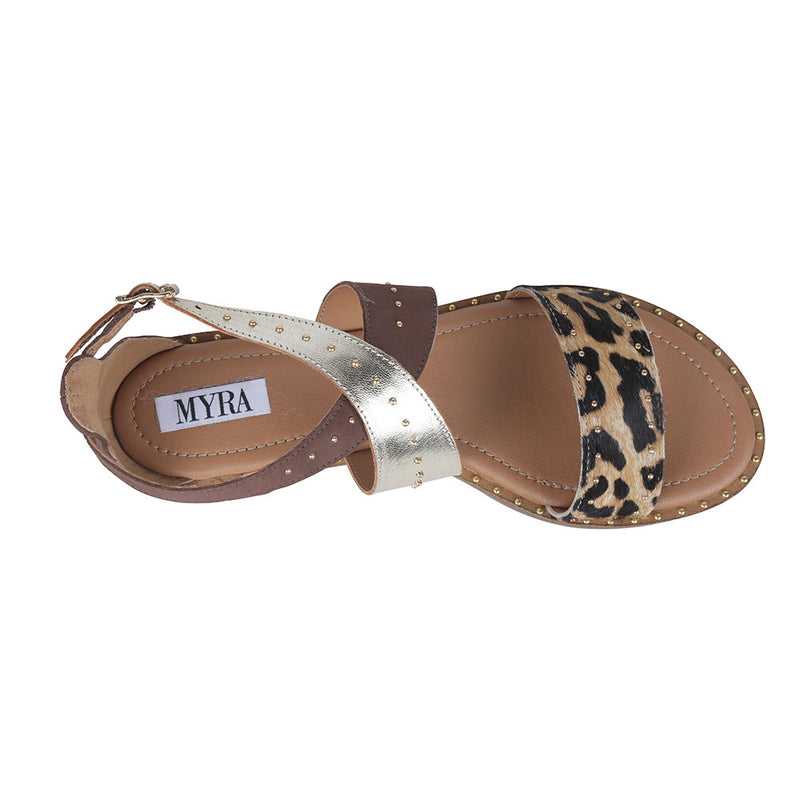 Western sandals with open-toe design in a combination of solid brown, tiger print, and metallic strap details