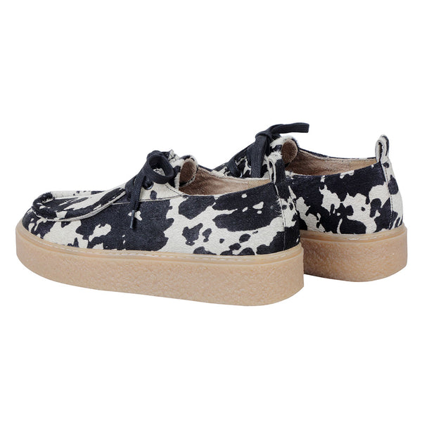 White and black western sneakers with a striking animal print pattern