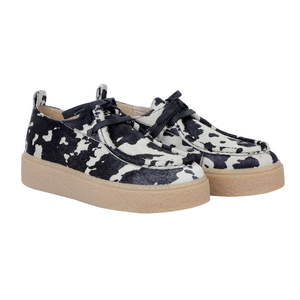 White and black western sneakers with a striking animal print pattern