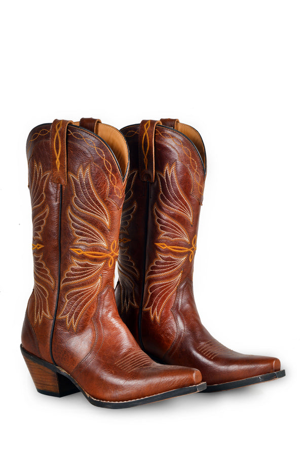 Brown leather embroided cowgirl boots with a pointed toe and a stacked heel