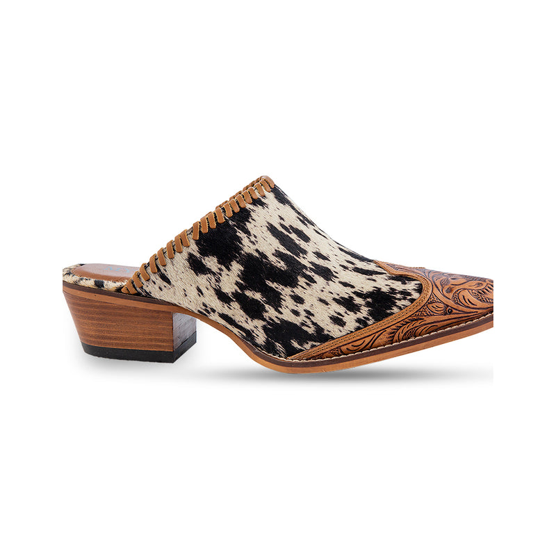 Handtooled western mules with pointed toe and black and white cowhide